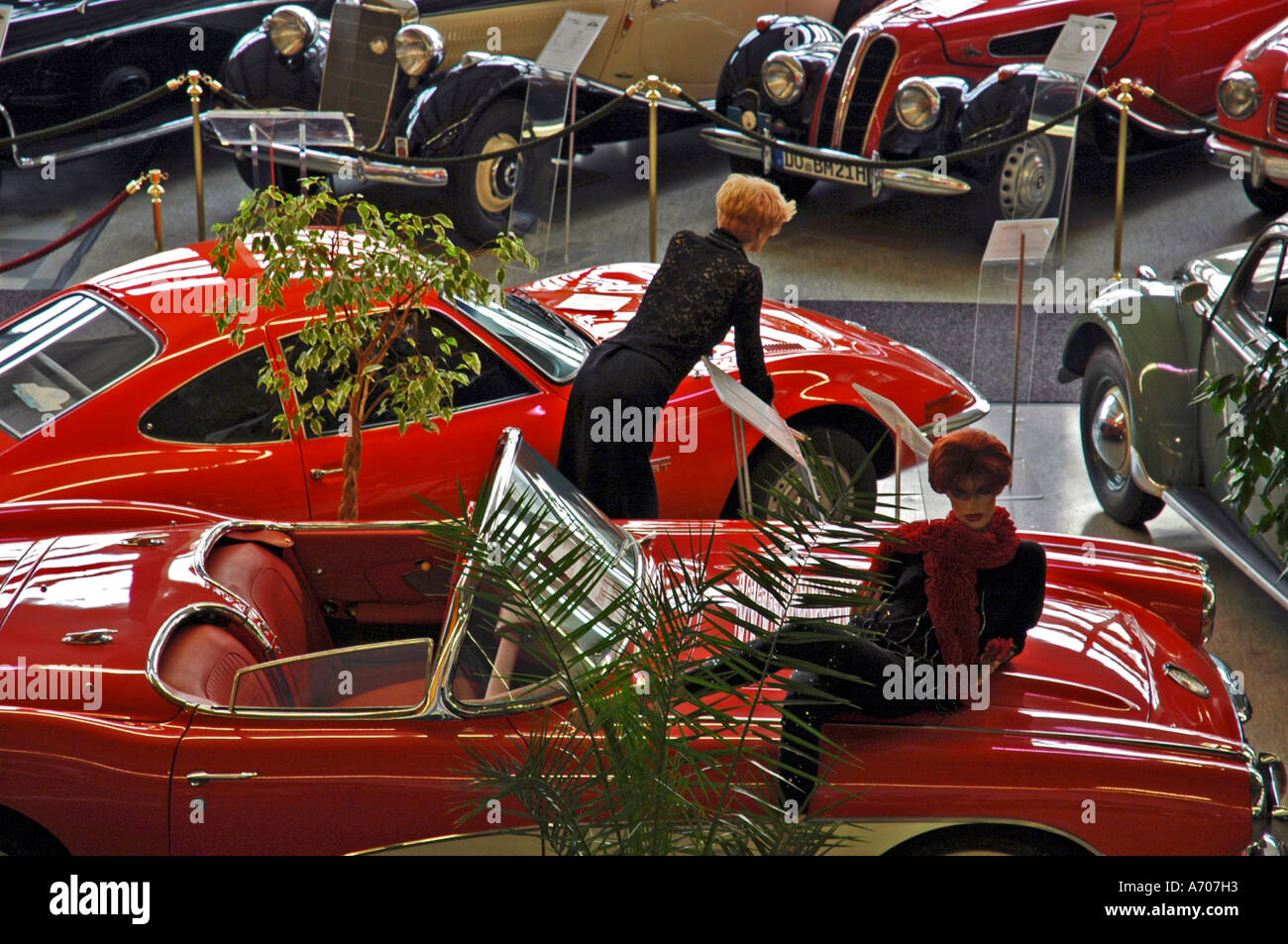 Red sports cars with dummies in vintage cars museum, Dortmund, NRW, Nordrhein Westphalia, Germany Stock Photo