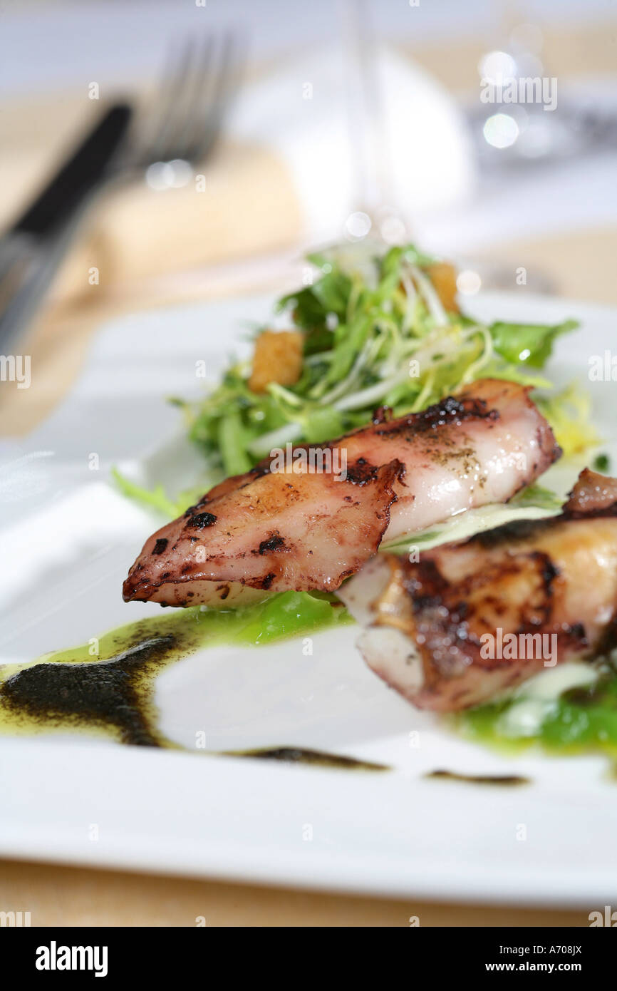 Squid salad with green pepper and black truffle oil Stock Photo Alamy
