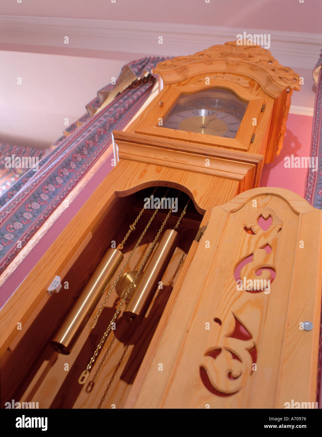 Hand crafted Norwegian grandfather clock, showing weights and pendulum Stock Photo Alamy