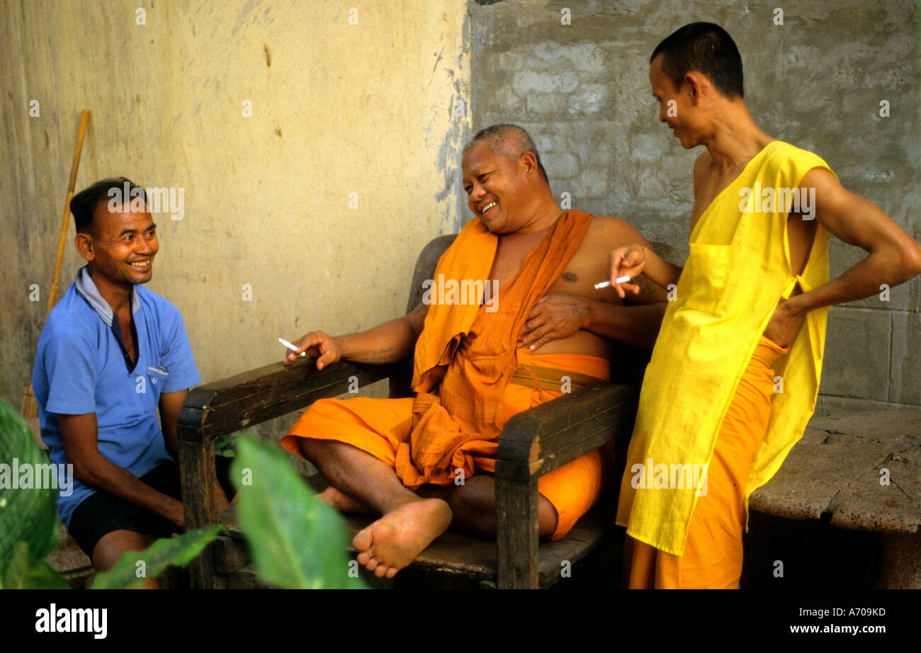 Smoking Thailand Thai Buddhist Priest Buddhism Buddha smoking cigarette Stock Photo