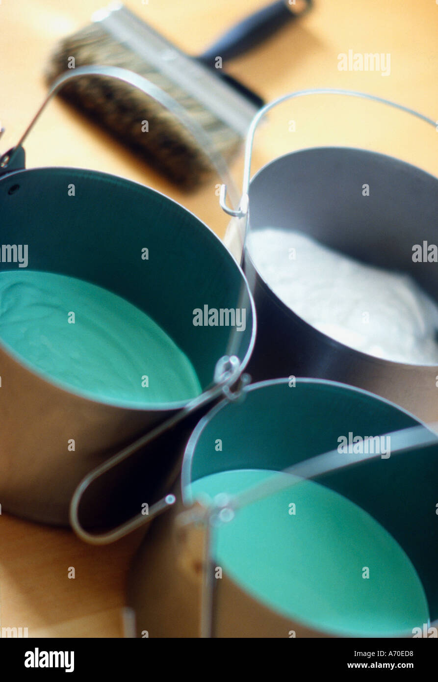 Paint kettles with jade green paint Stock Photo Alamy