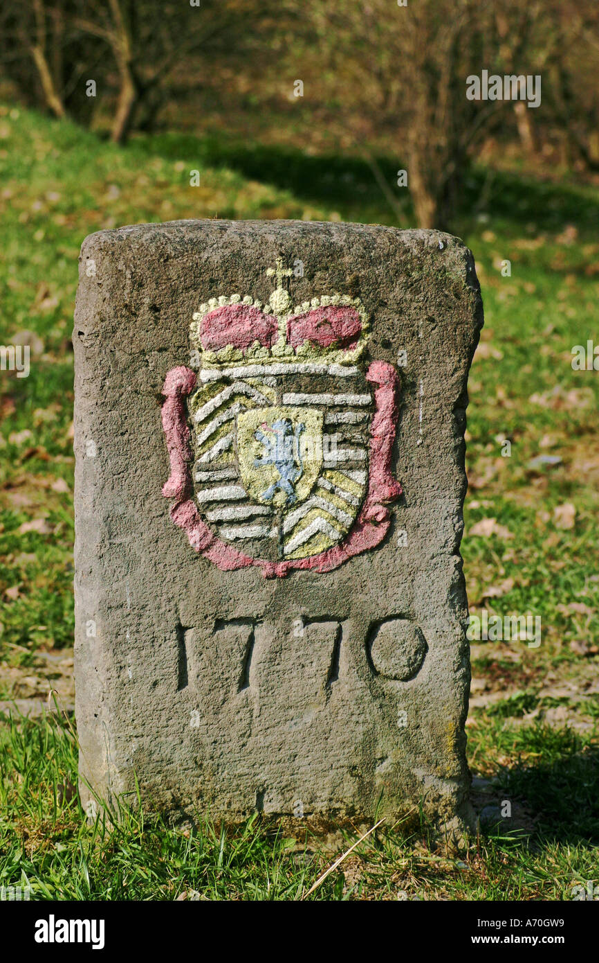 Historical boundary stone with colored heraldic figure and date of the year 1770 Stock Photo