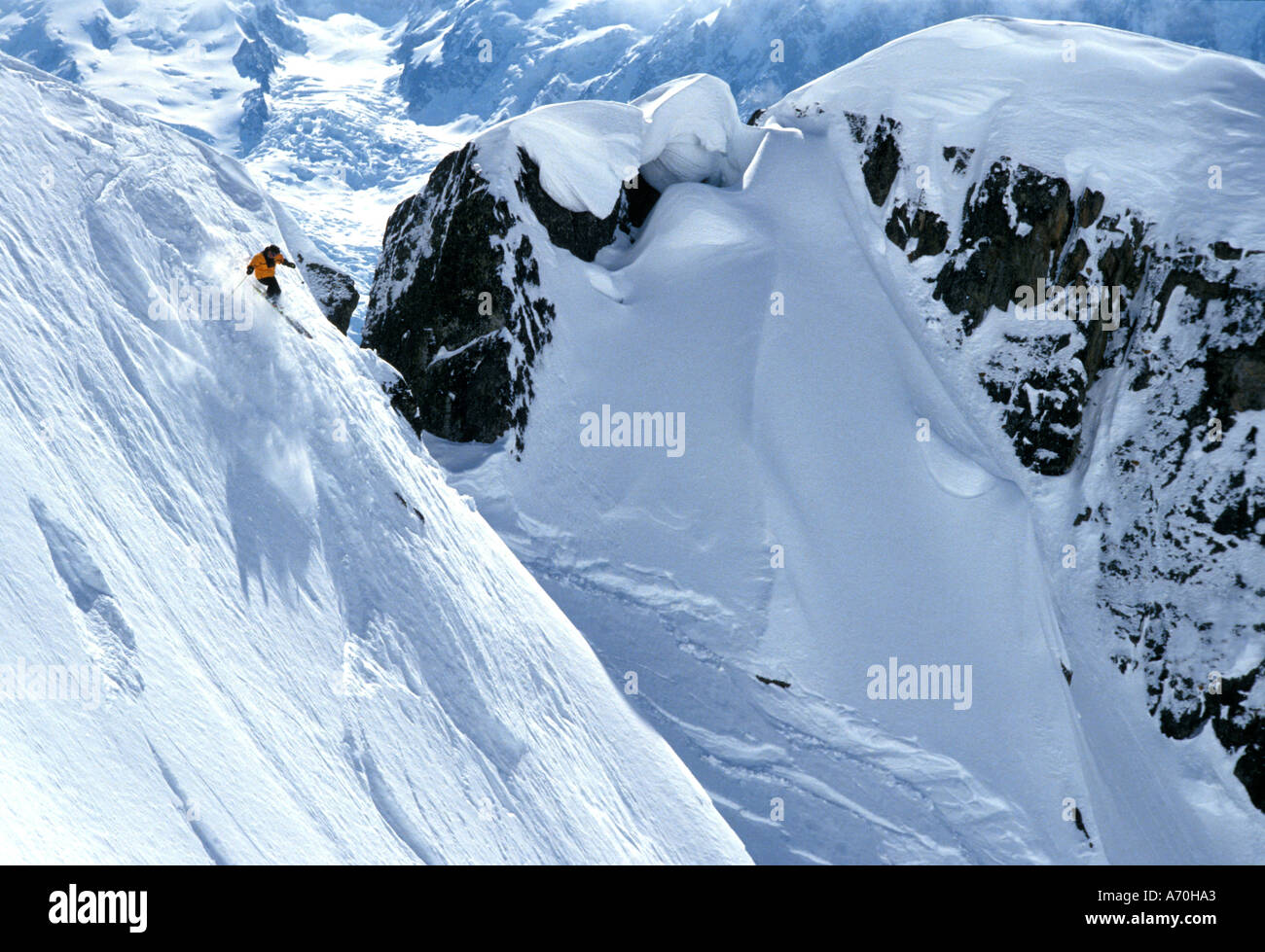 Lone extreme skier off piste high in the peaks in the Chamonix area France Stock Photo