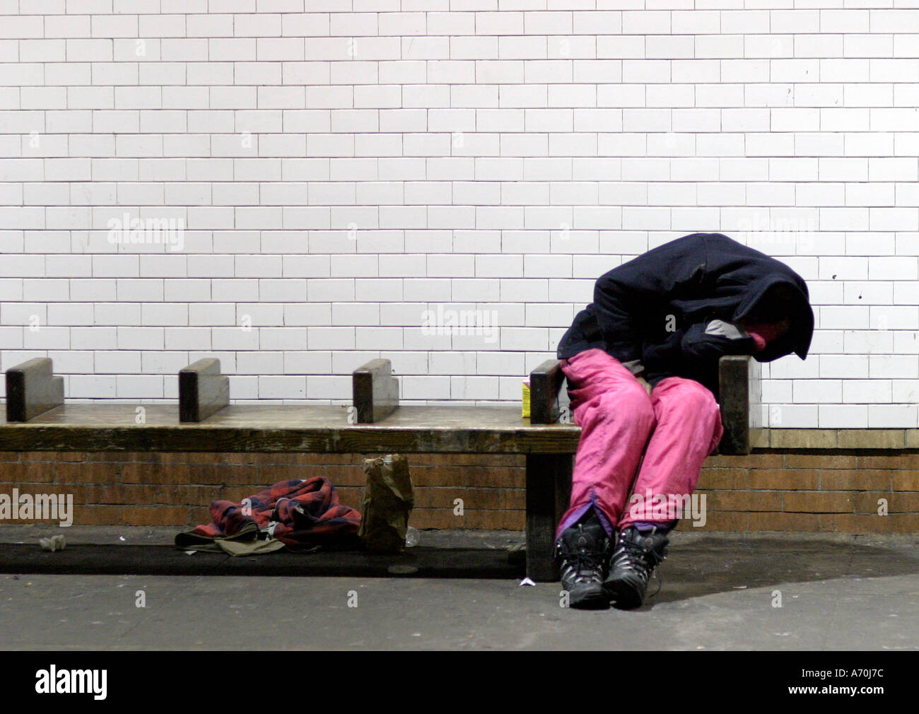 Sleeping homeless man 1 New York City Subway Stock Photo - Alamy