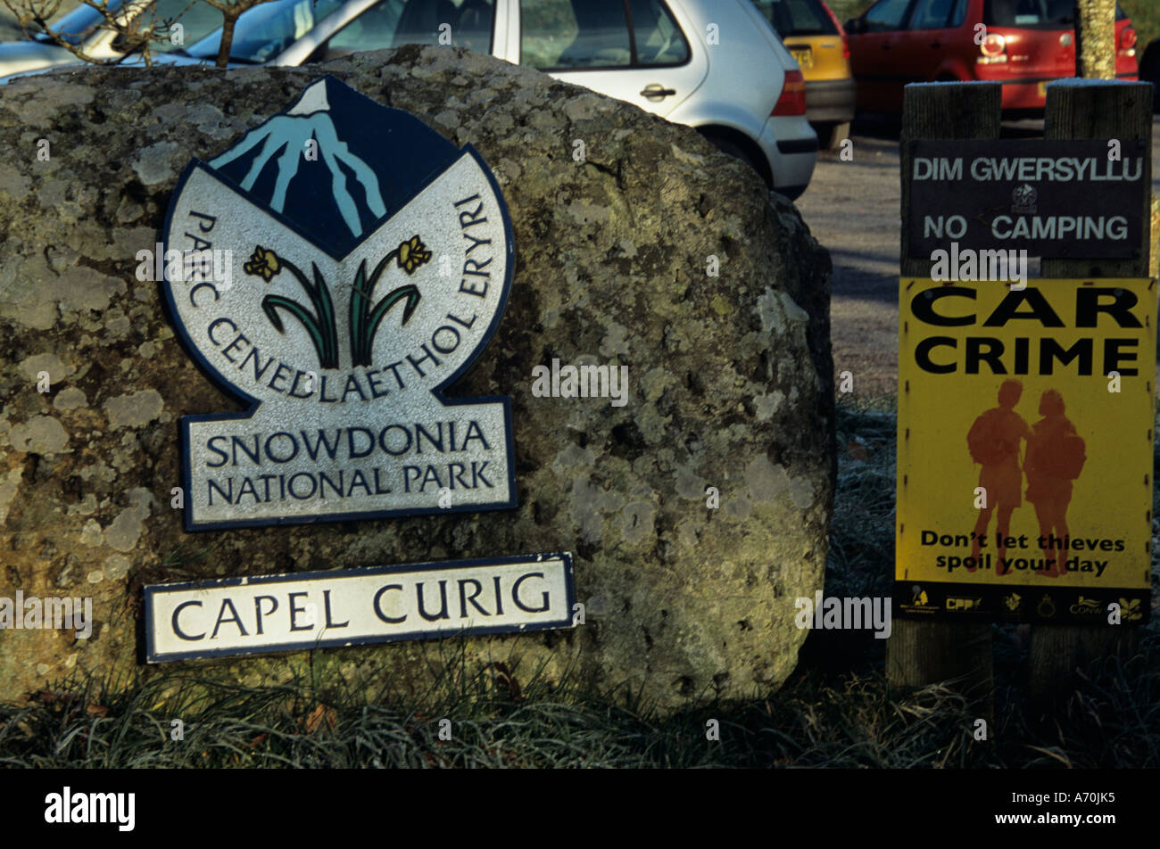 CAPEL CURIG CONWY NORTH WALES UK January Sign for Snowdonia National Park and a warning about car thieves operating in the area Stock Photo