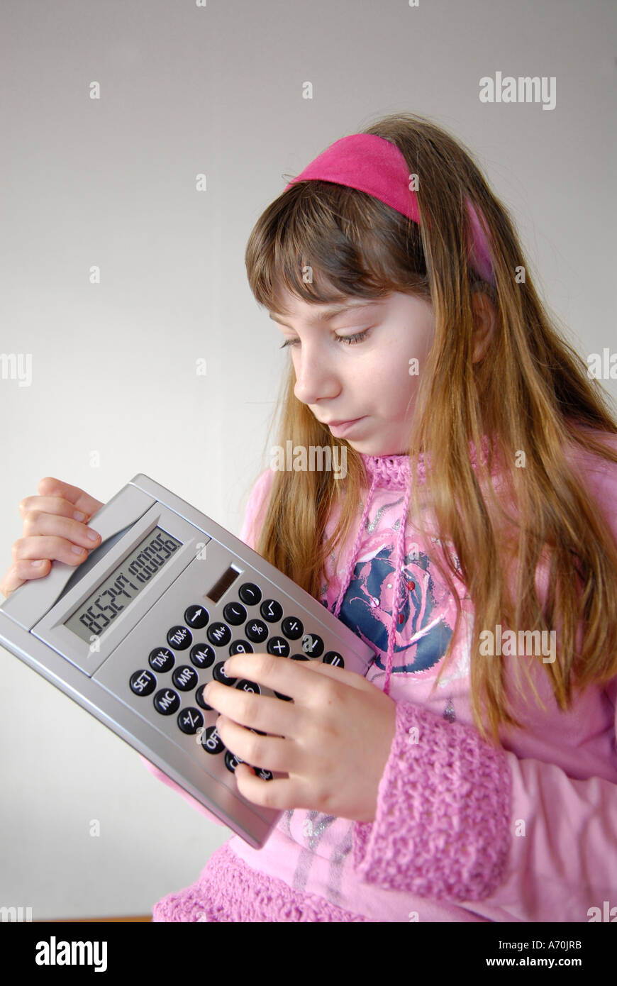 Girl with pocket calculator Stock Photo - Alamy