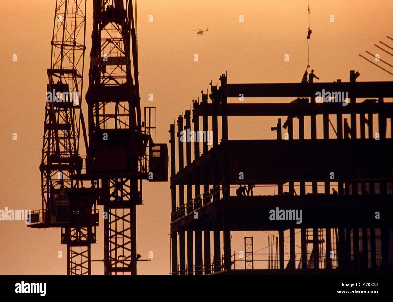 STEEL FRAME BUILDING UNDER CONSTRUCTION EVENING UK Stock Photo - Alamy
