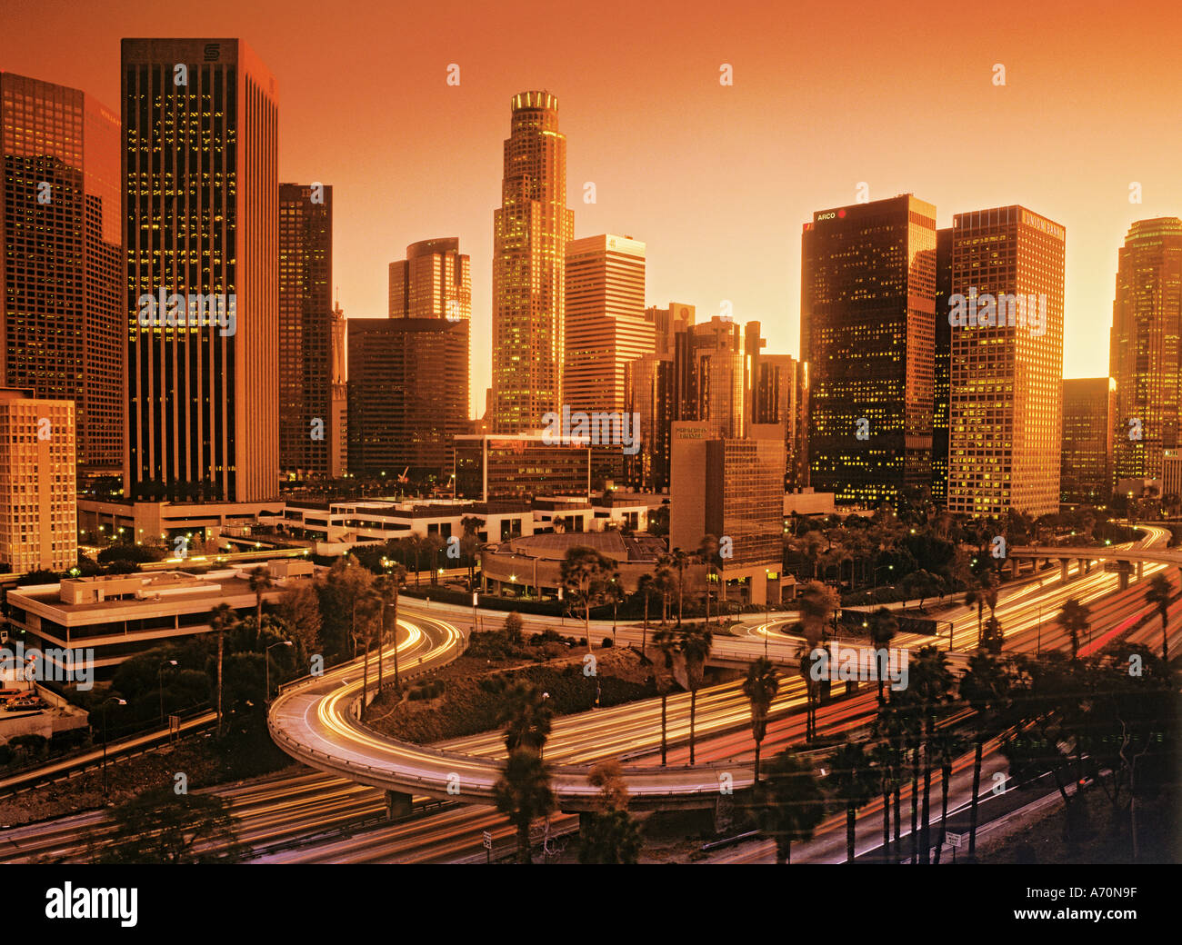 Downtown Los Angeles with rush hour traffic passing on roads and