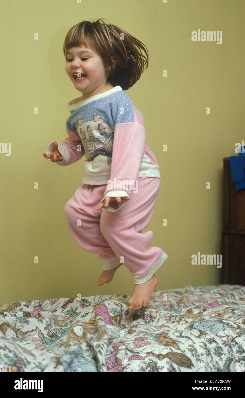 child bouncing on the bed Stock Photo Alamy