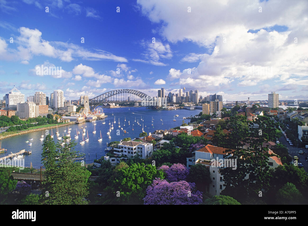 Sydney Harbour Bridge and city skyline from Lavender Bay in North Sydney with Luna Park on left Stock Photo