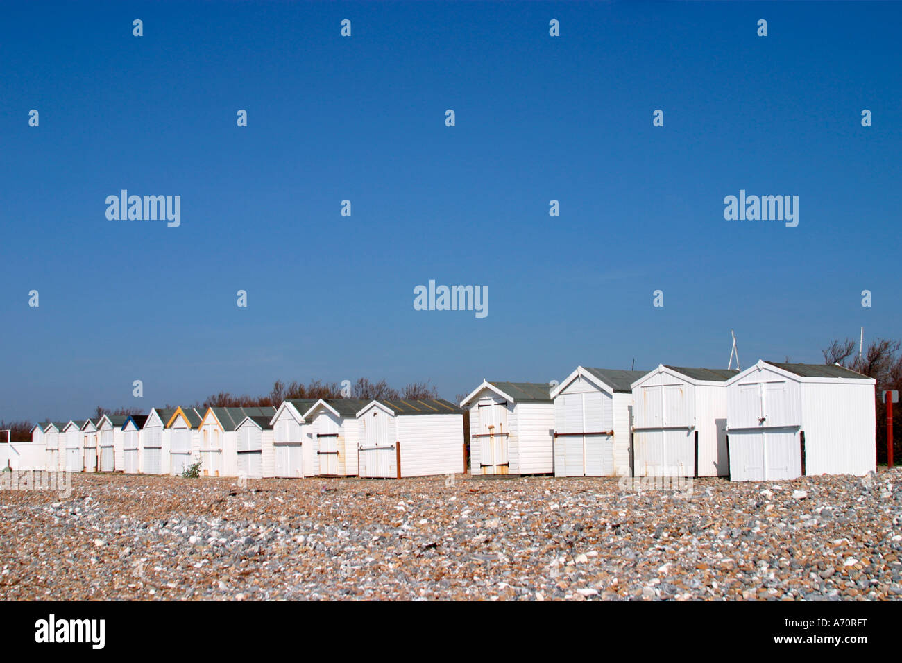 White painted beach huts on seafront at Goring by sea, Sussex Stock