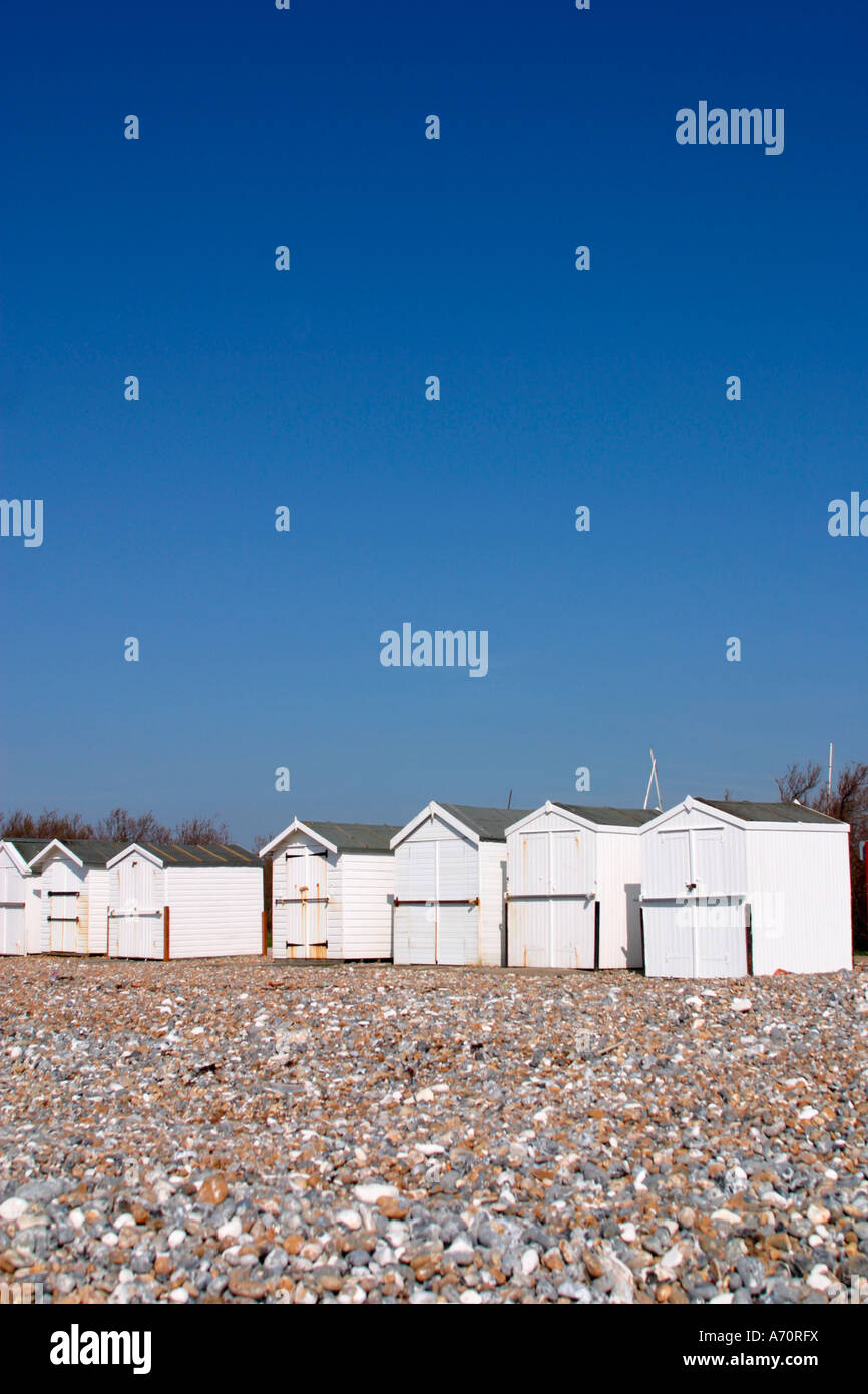 White painted beach huts on seafront at Goring by sea, Sussex, UK Stock