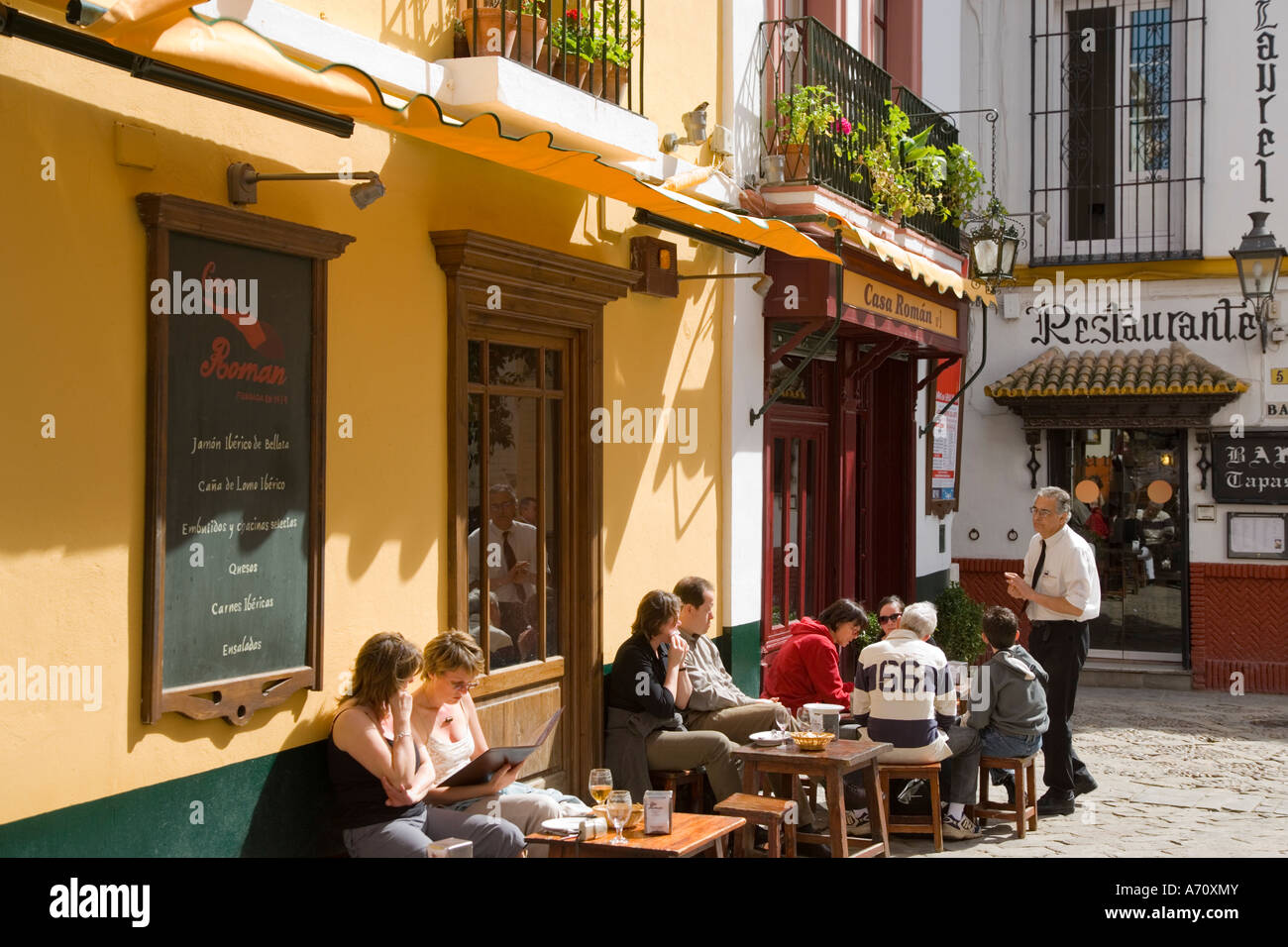 Seville Seville Province Spain Outdoor bar scene in Barrio de Santa