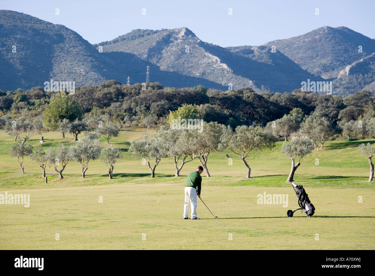 Alhaurin de la Torre,  Malaga Province,  inland Costa del Sol, southern Spain.  Lauro Golf course.  Hitting on fairway. Stock Photo