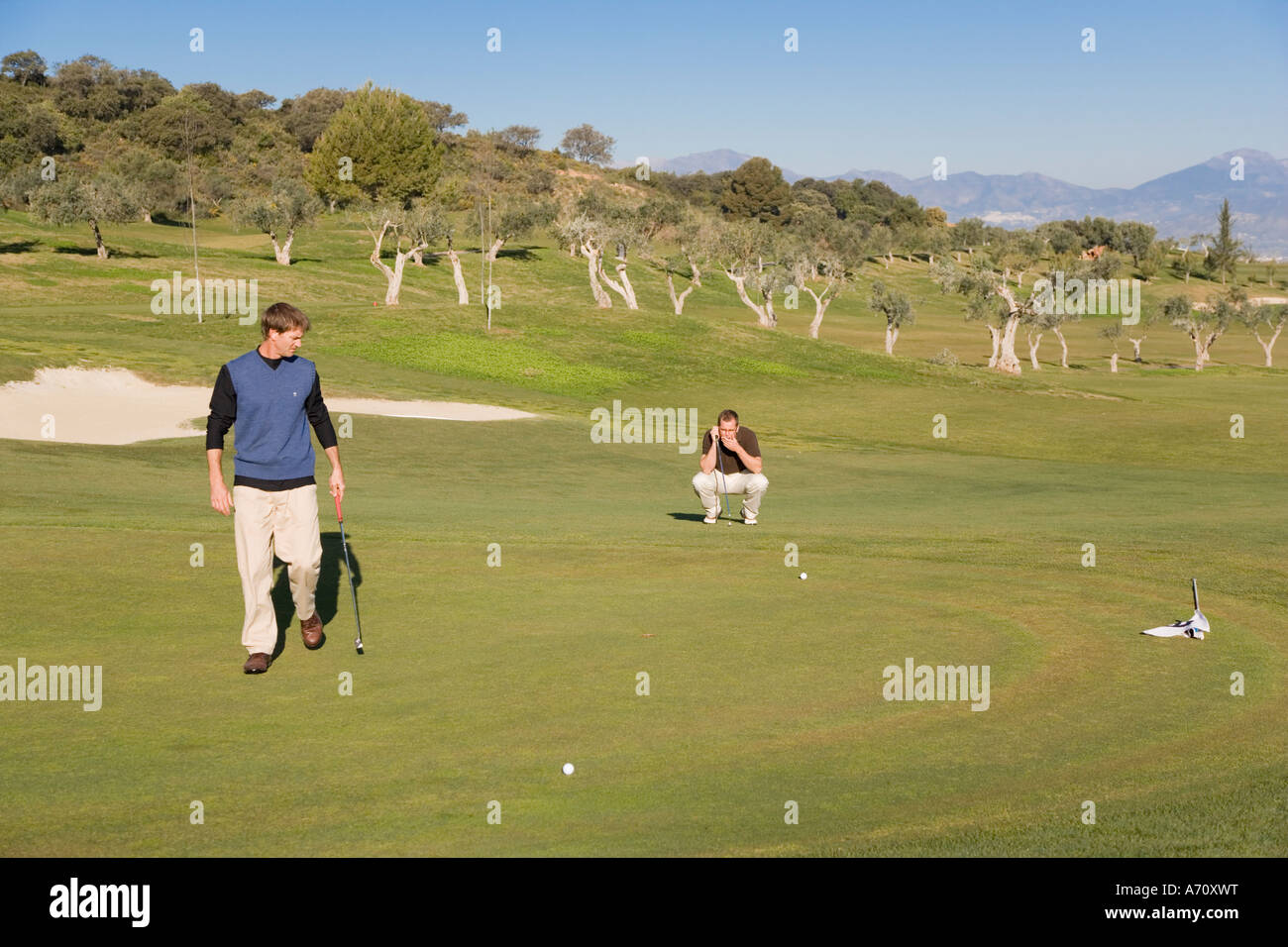 Alhaurin de la Torre,  Malaga Province,  inland Costa del Sol, southern Spain.  Lauro Golf course. Man putting on green. Stock Photo