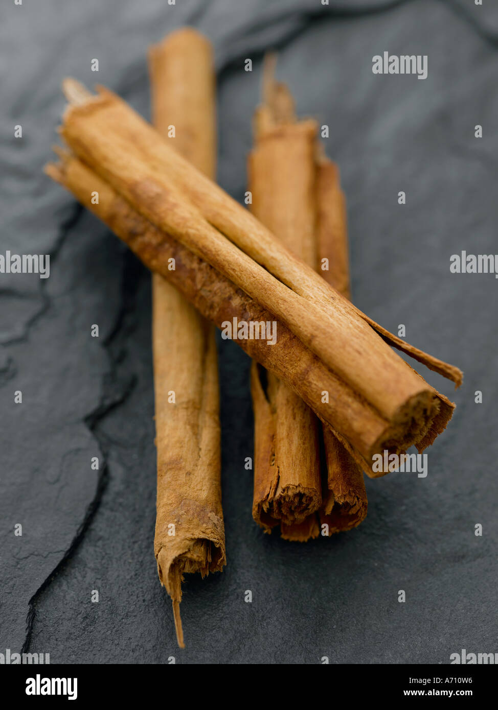 Cinnamon sticks on black slate background - high end Hasselblad 61mb digital image Stock Photo
