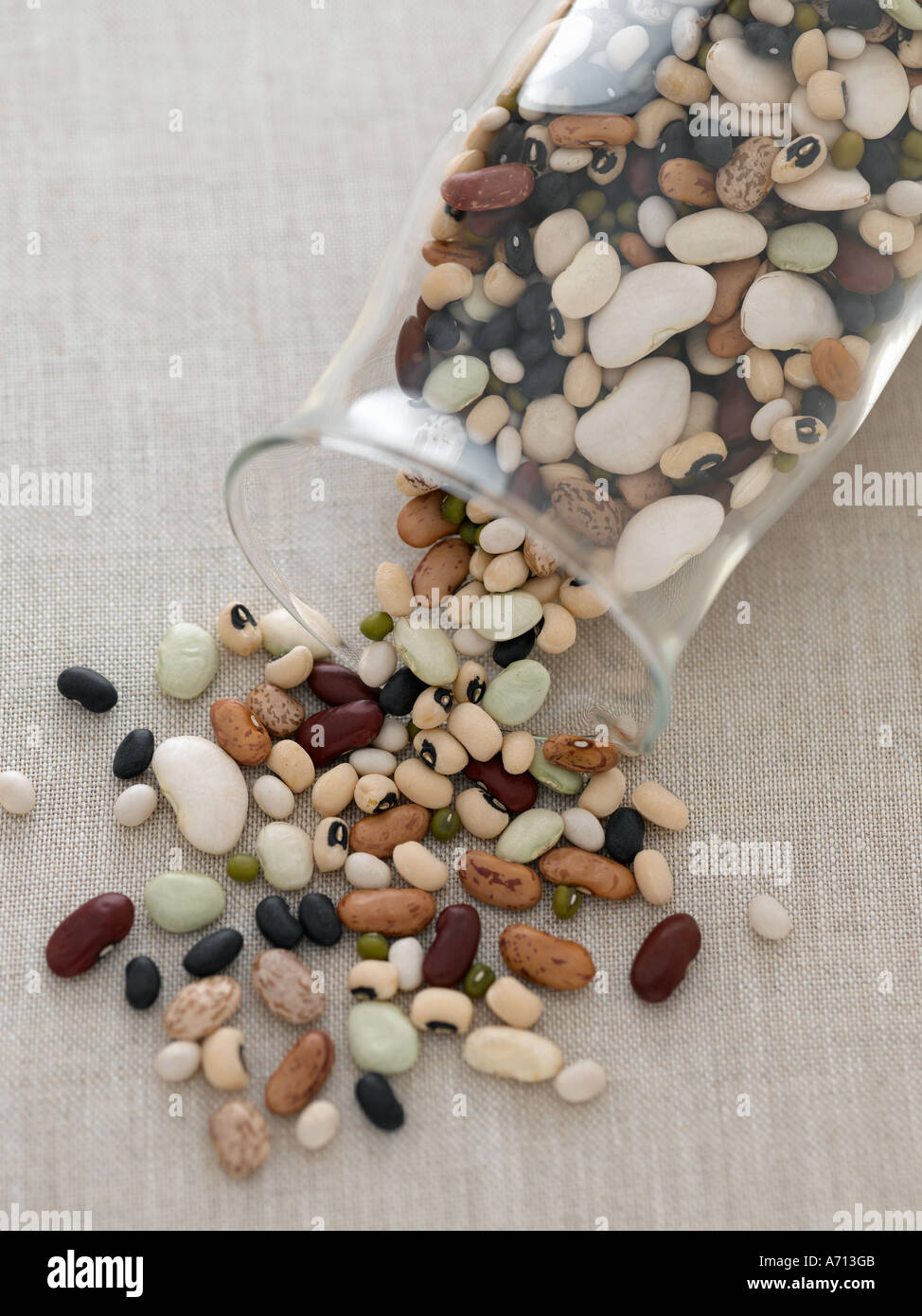 Mixed beans in glass jar on natural linen - high end Hasselblad 61mb digital image Stock Photo