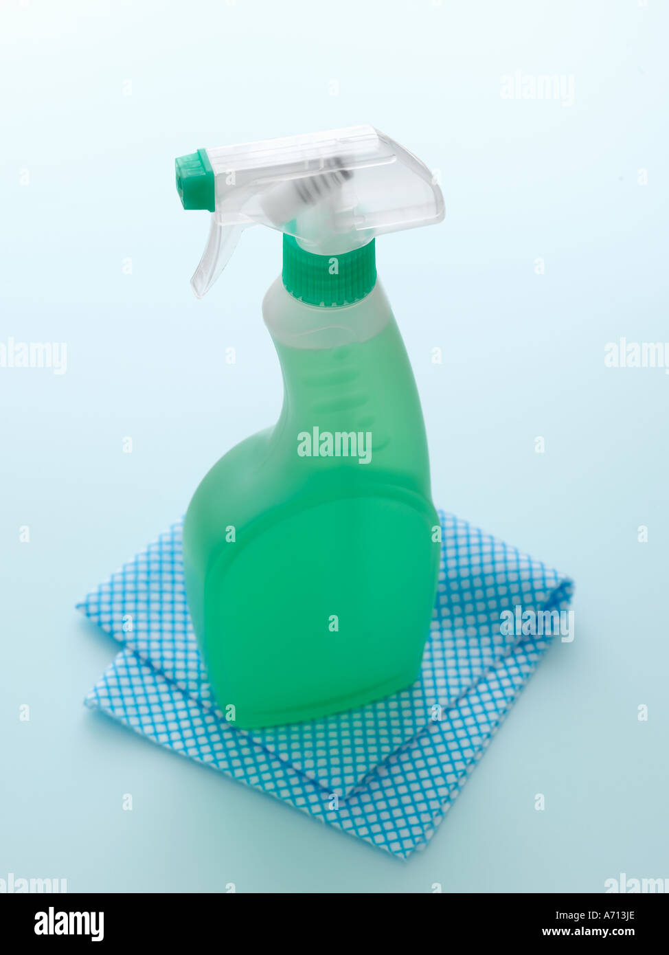 Cleaning product with cloth on pale blue background high end