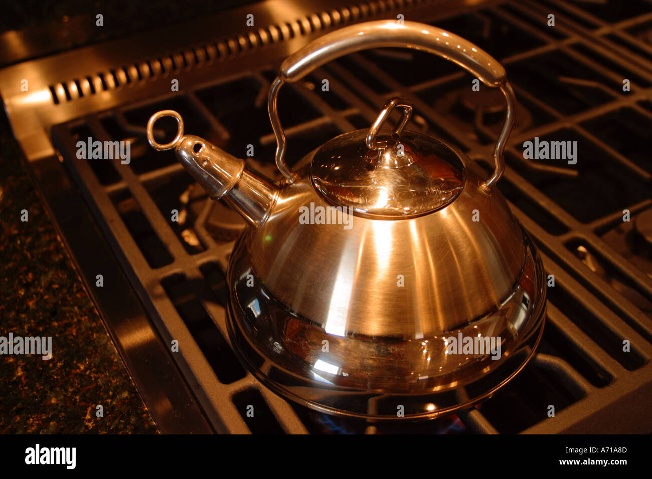 Teapot on stove Stock Photo Alamy