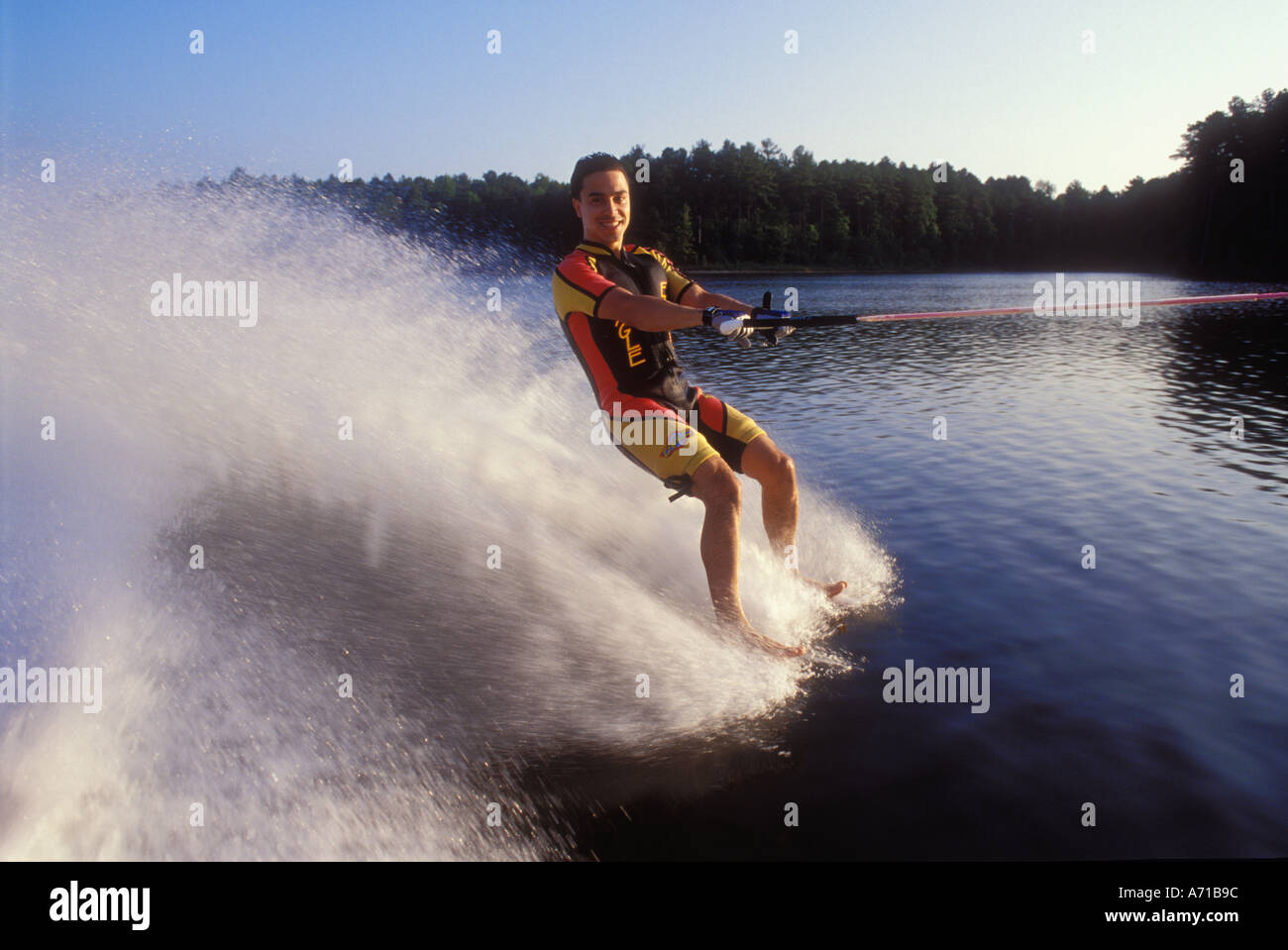 Man barefoot waterskiing North Carolina USA model released image Stock Photo