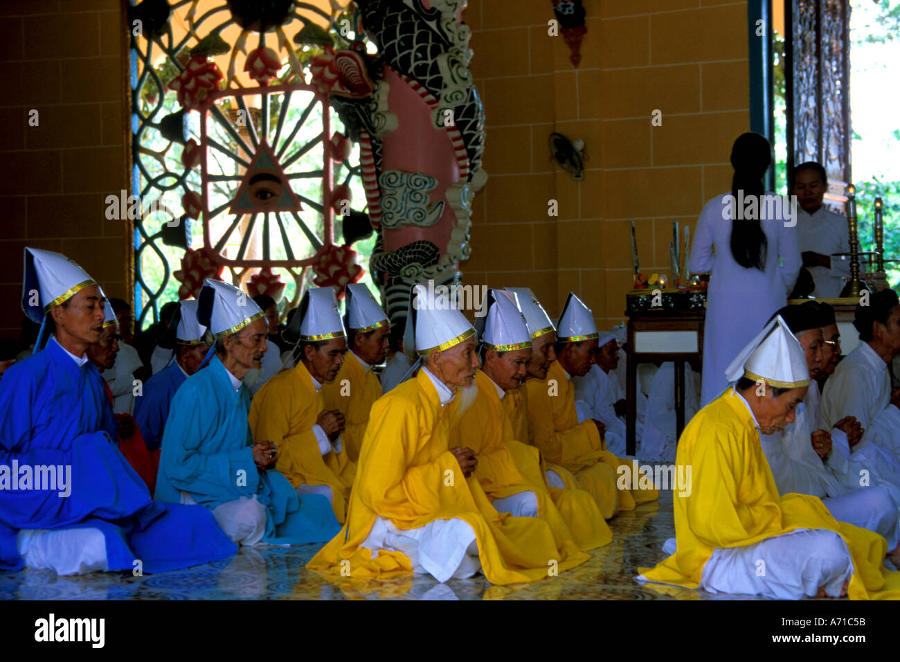 The Celebrants at Noon Service at Cao Dai Temple Tay Ninh Vietnam Stock Photo