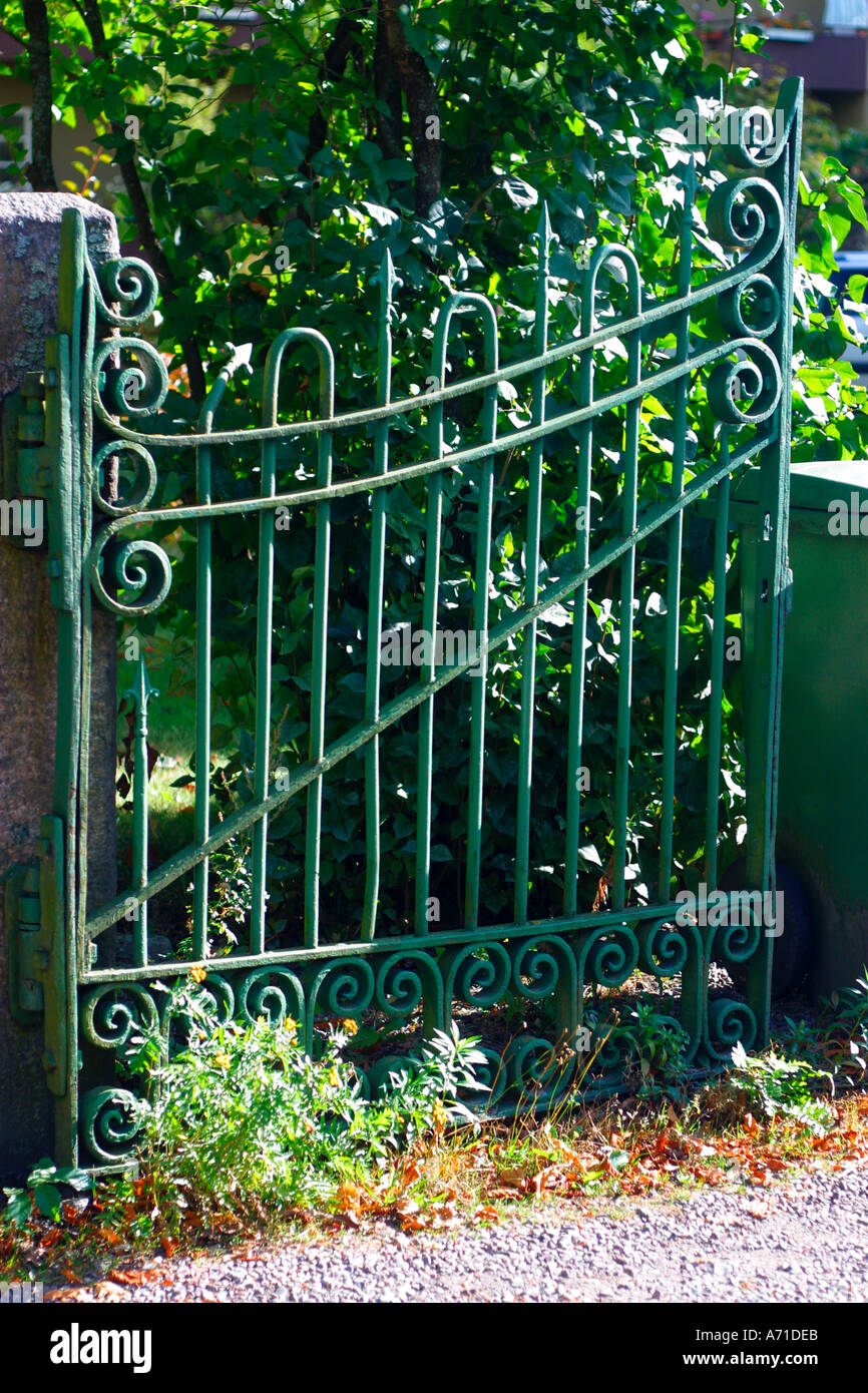 An ornate green garden gate Stock Photo Alamy