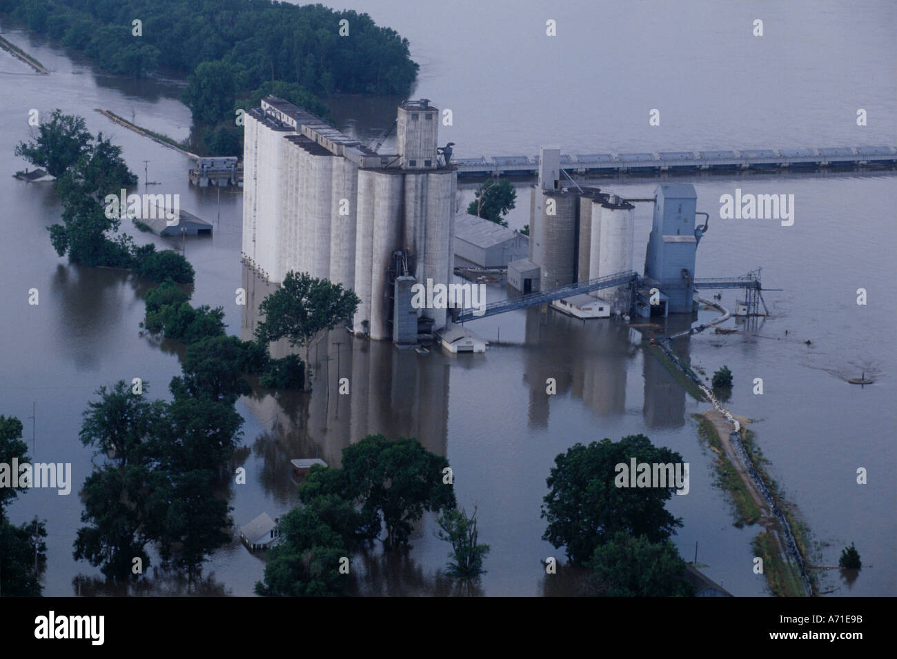 Aerial view of a grain elevator that is surrounded by water due to an overflowing Mississippi River in Meyer IL Stock Photo