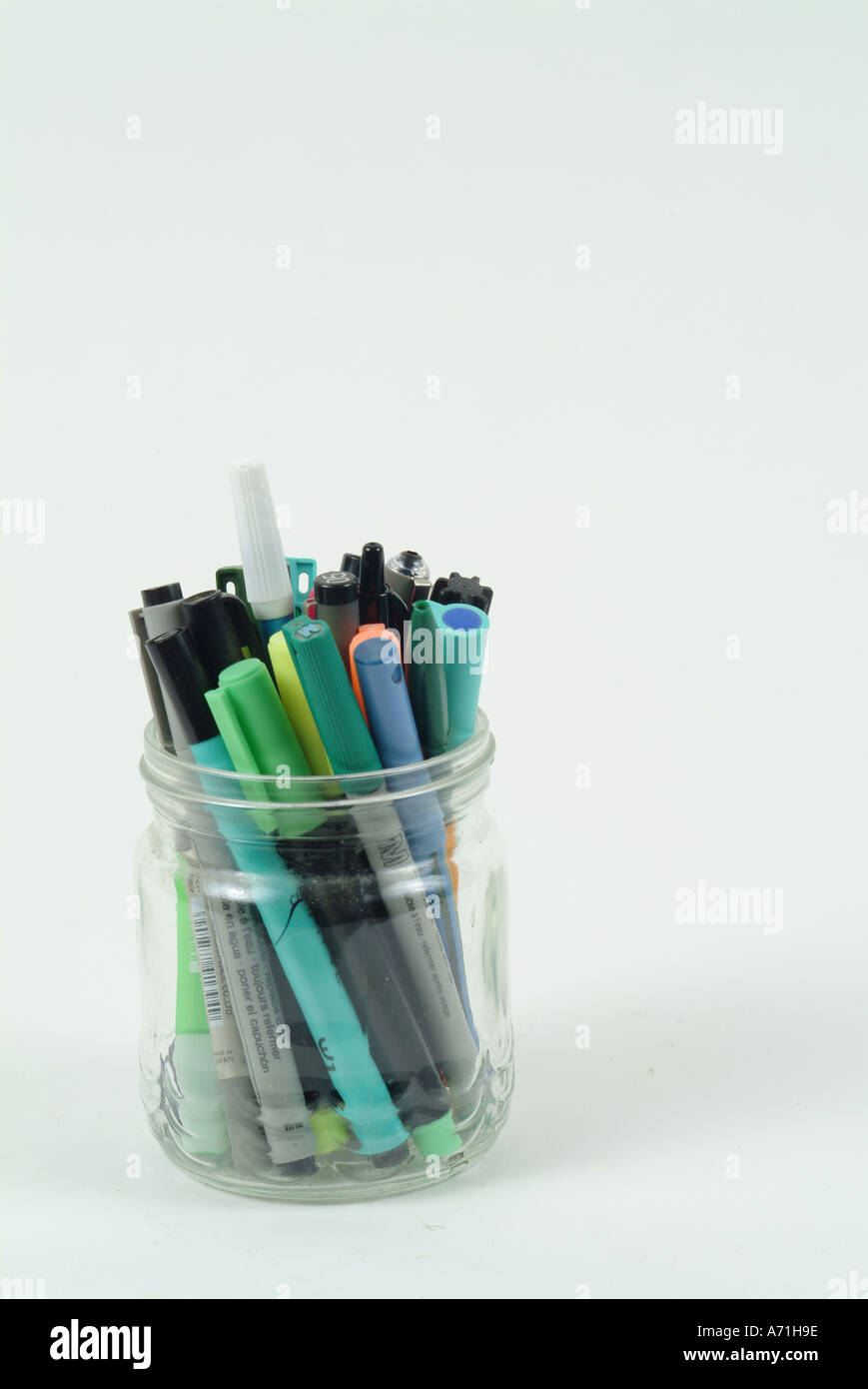 Collection of pens and markers in a clear glass jar Stock Photo Alamy