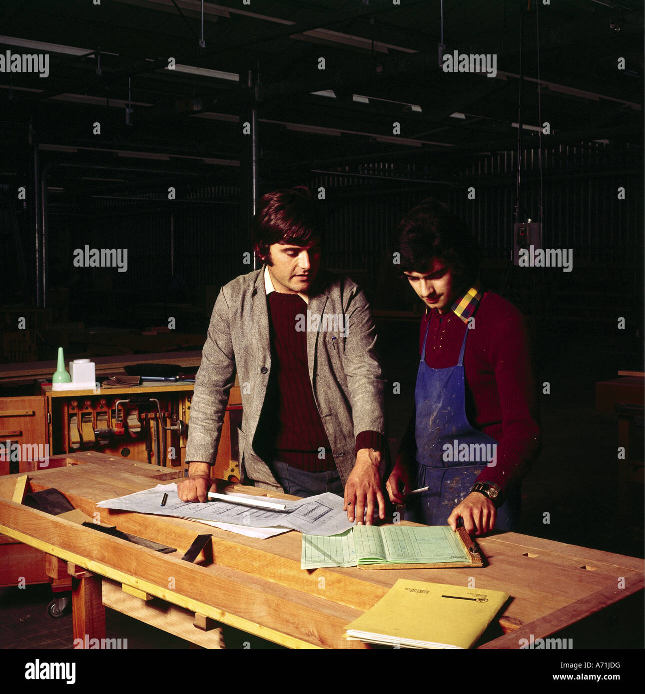 people, profession, cabinetmaker, two carpenters with plans, 1970s, Stock Photo