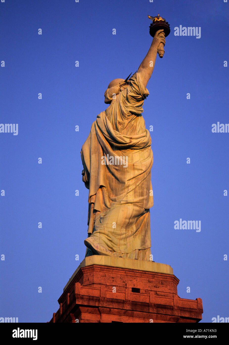Statue of Liberty, full figure, profile, pedestal. Close up side view