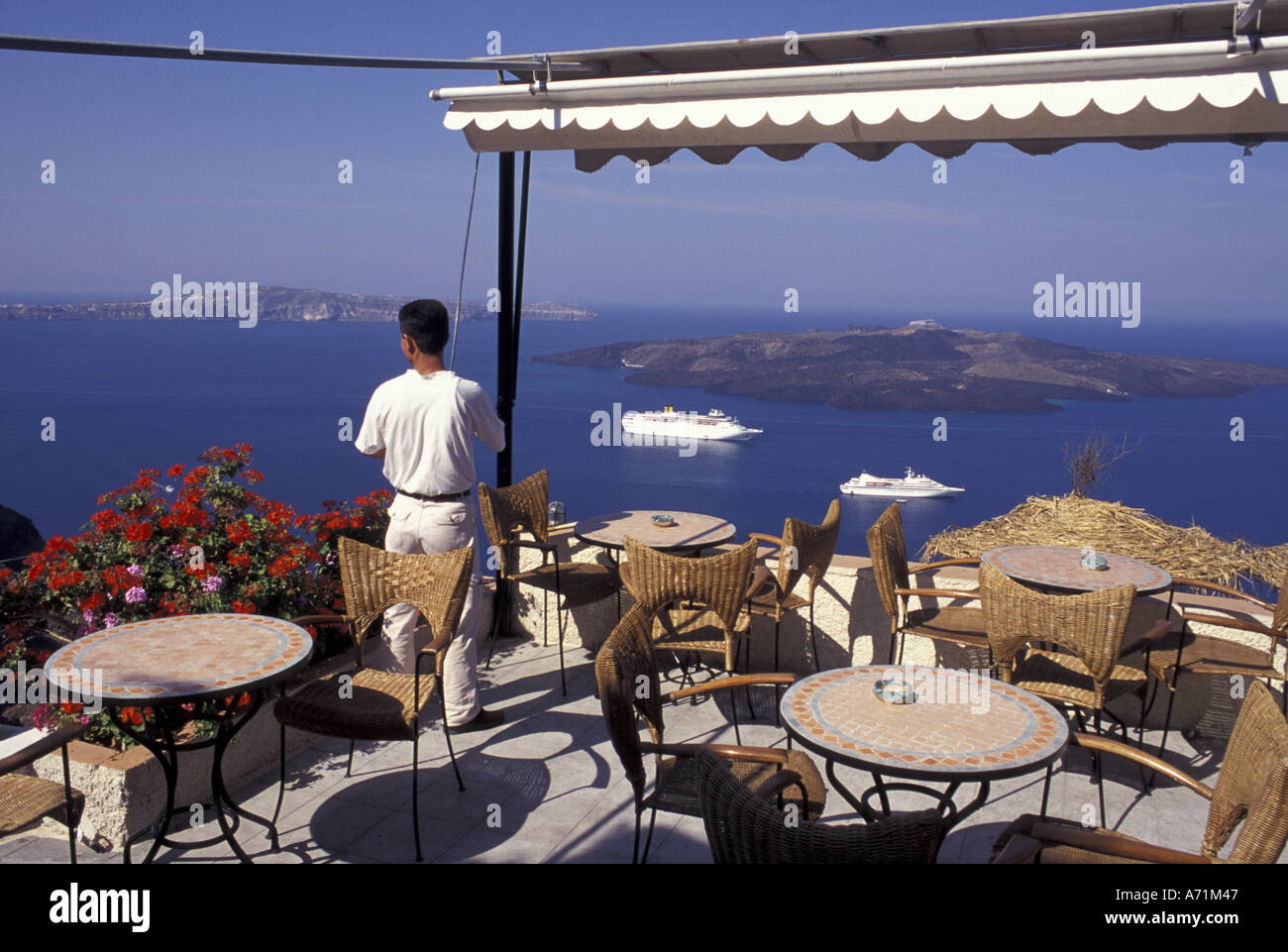 Greece, Santorini, Fira Restaurant, facing caldera and cruise ships Stock Photo