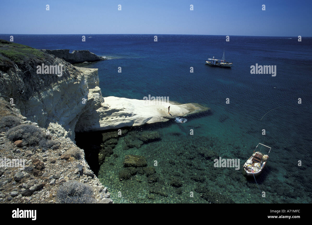 Greece, Cyclades Islands, Milos. Gerontas, white sandstone rock fingers and view of Aegean Sea Stock Photo