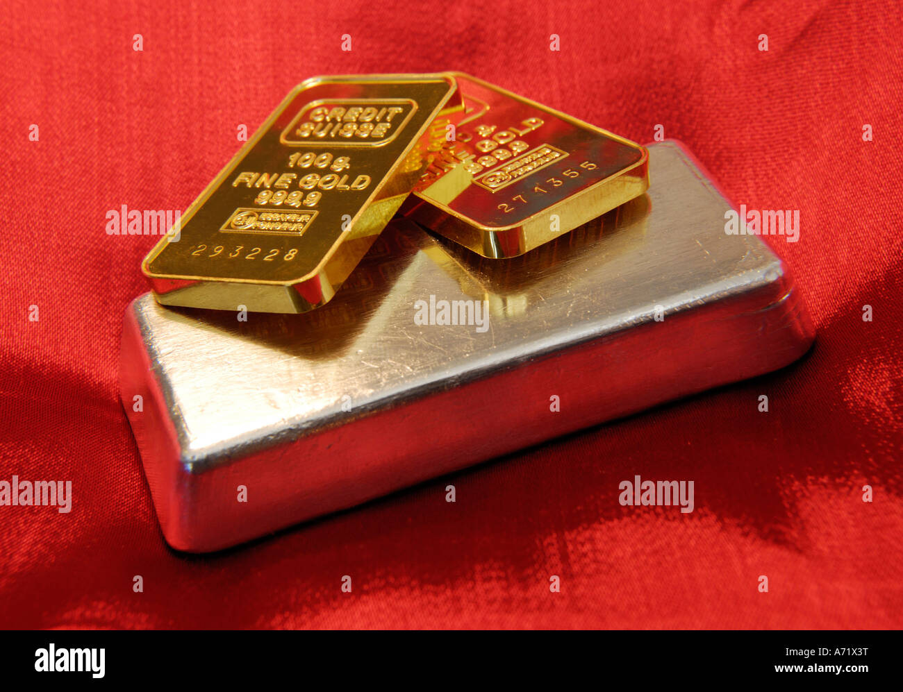 Close up of two 100 grams heavy solid gold bars and a 500 grams heavy solid silver bar Stock Photo
