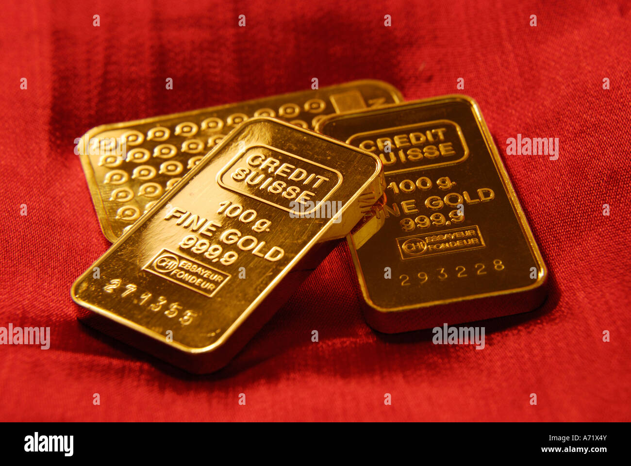 A pile of three 100 grams heavy solid gold bars from Swedish and Swiss companies Boliden and Credit Suisse Stock Photo