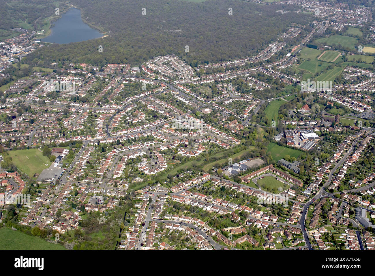 Aerial high level oblique view north of houses and suburbs of Ruislip with River Pinn Whiteheath