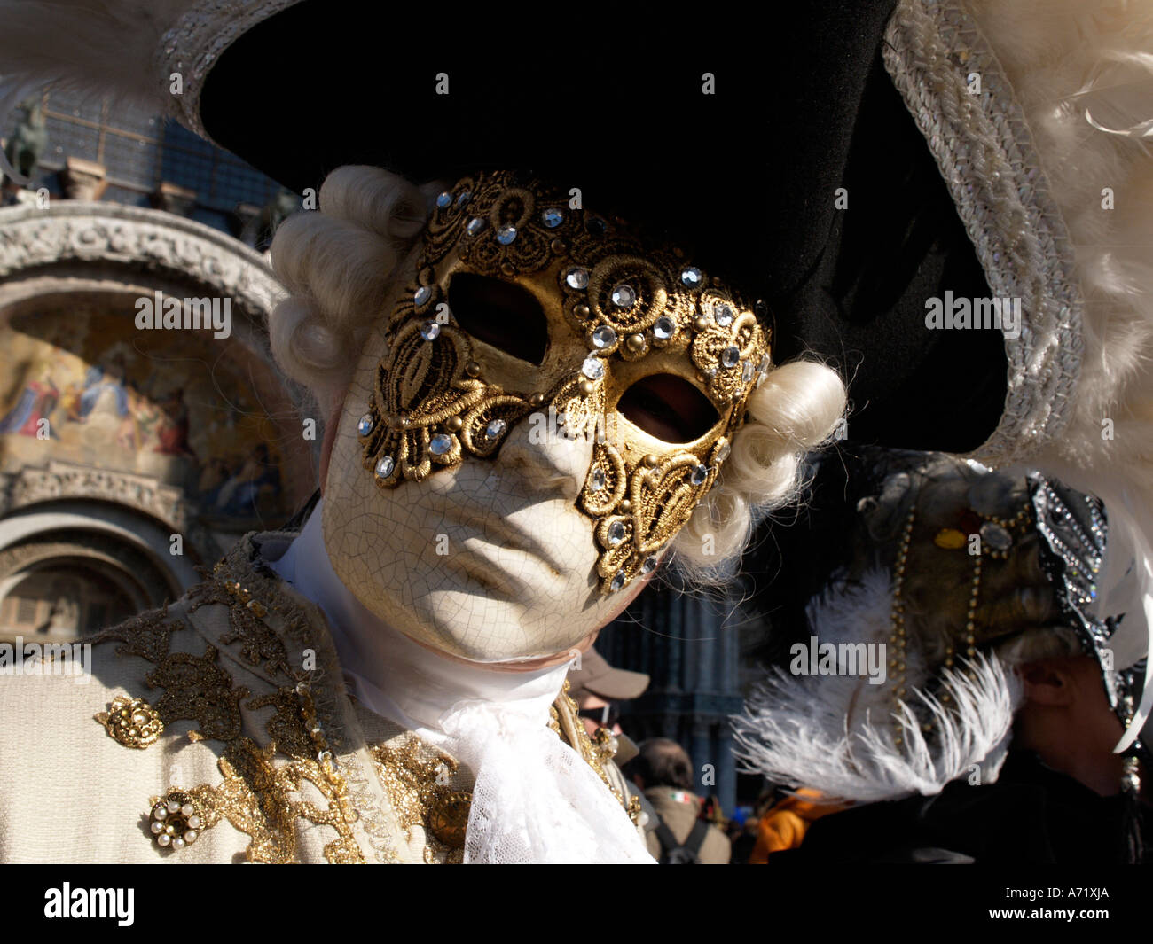 man wearing 18th century costume and mask at Venice carnival Stock Photo