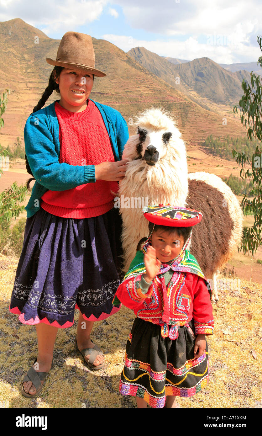 Indian woman with llama and child hi-res stock photography and