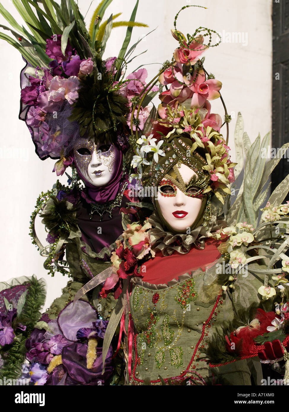 two 2 women wearing floral costume at Venice carnival Stock Photo - Alamy