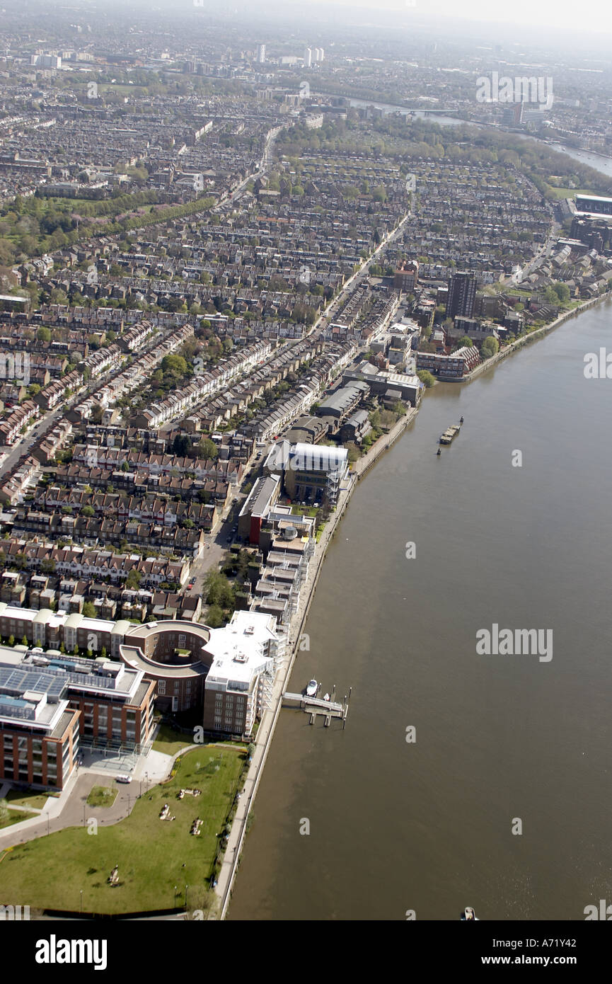 Aerial high level oblique view south of suburbs and houses of