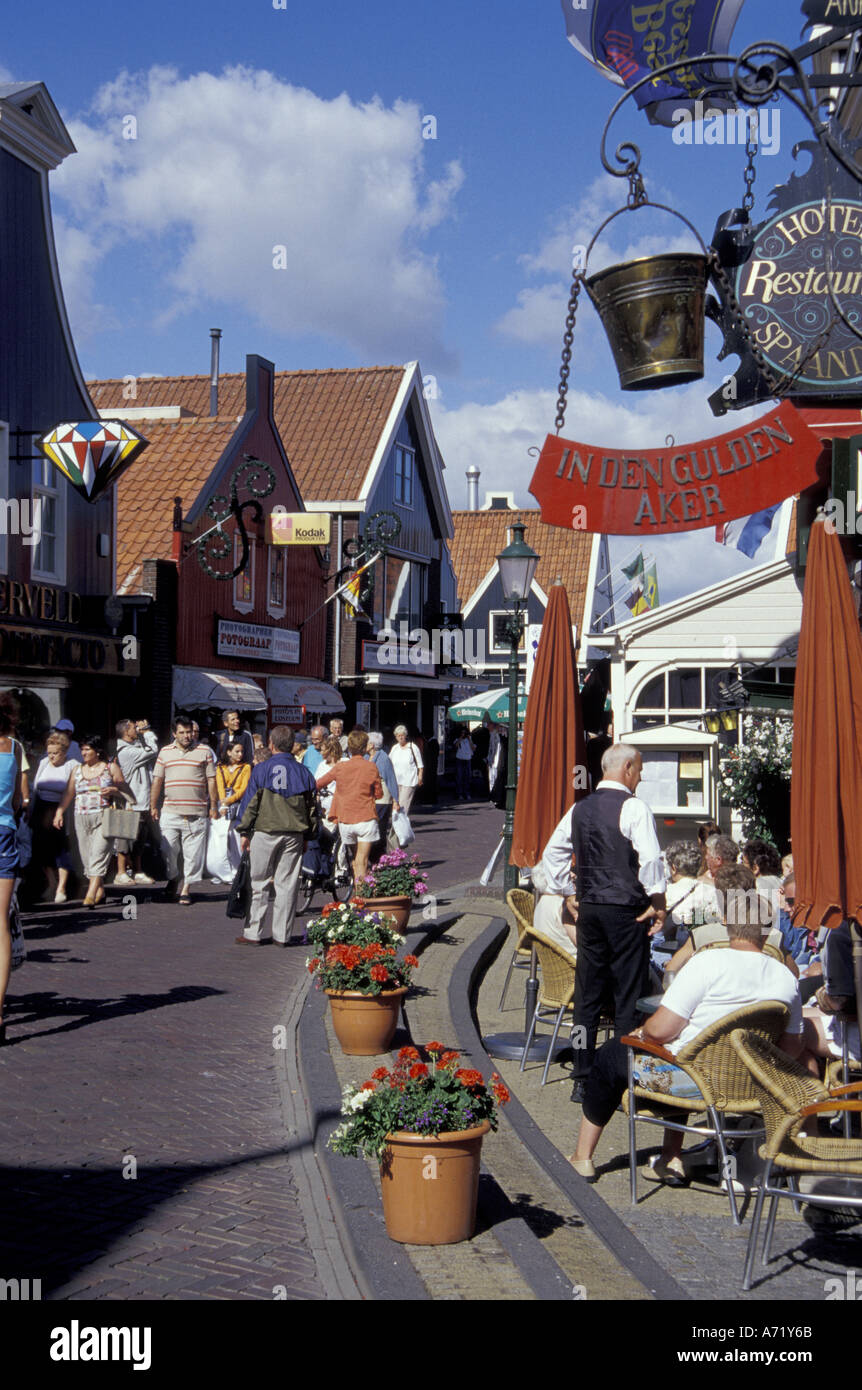 Europe, Netherlands, Volendam Tourists crowd the 14th Century seaside streets lined with shops and cafes Stock Photo