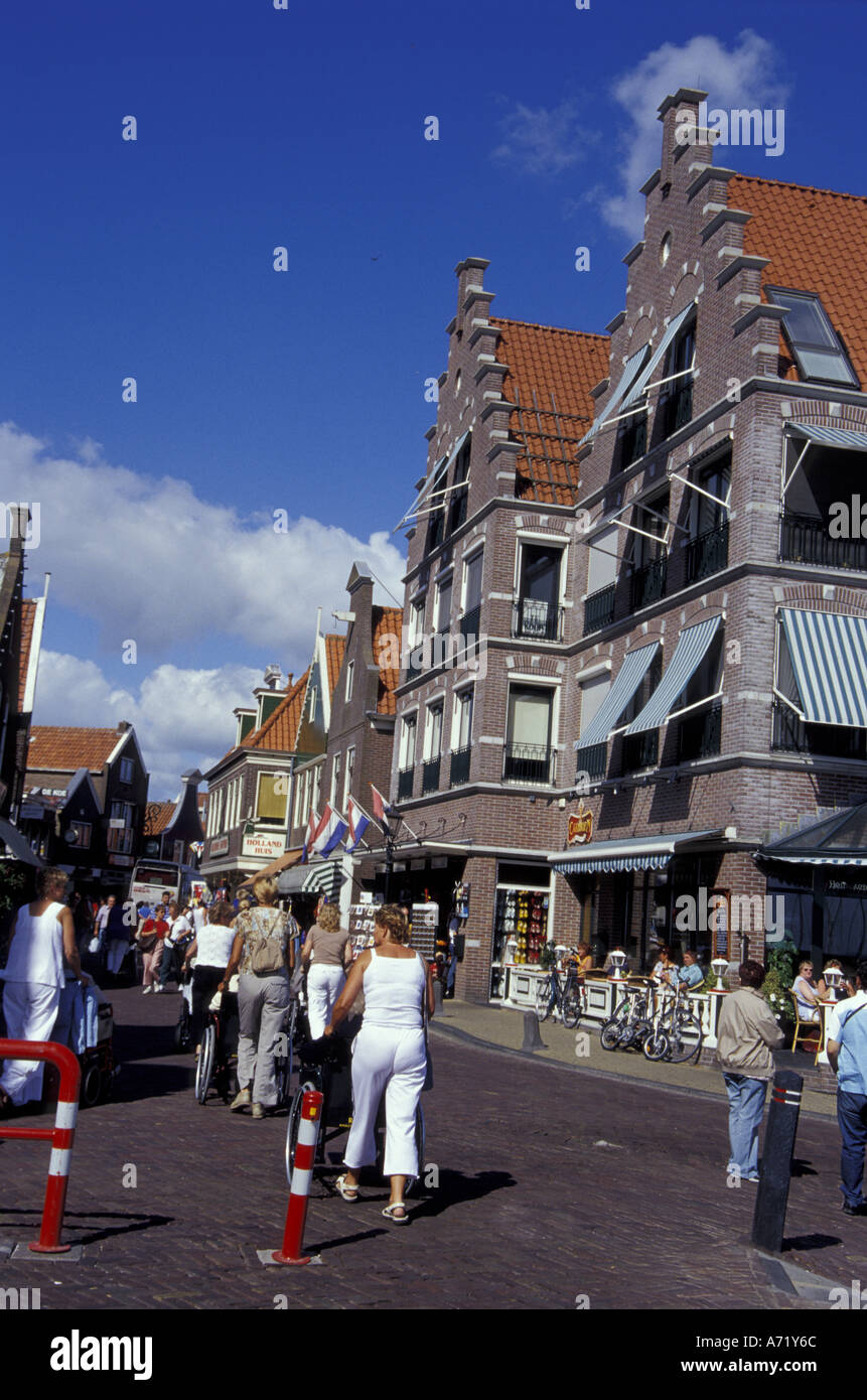 Europe, Netherlands, Volendam Tourists crowd the 14th Century seaside streets lined with shops and cafes Stock Photo