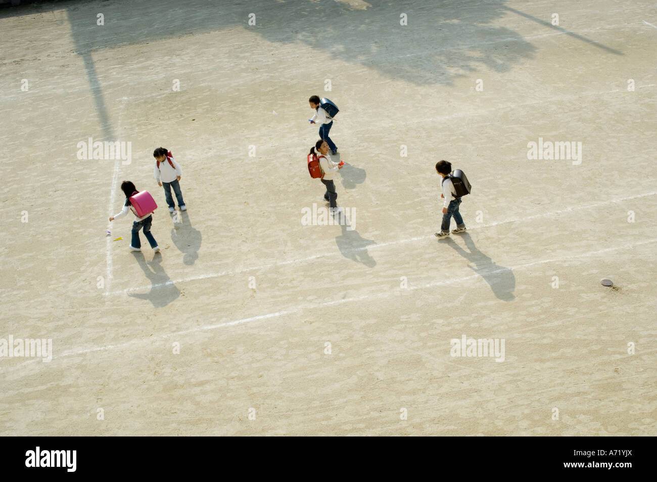 Children playing in schoolyard Stock Photo