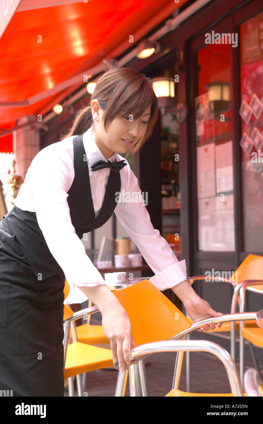 Waitress setting table Stock Photo Alamy