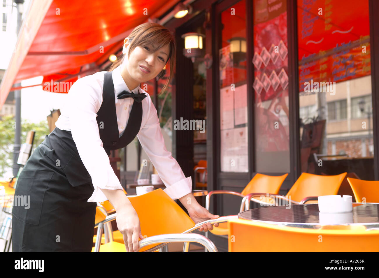 Waitress setting table Stock Photo Alamy