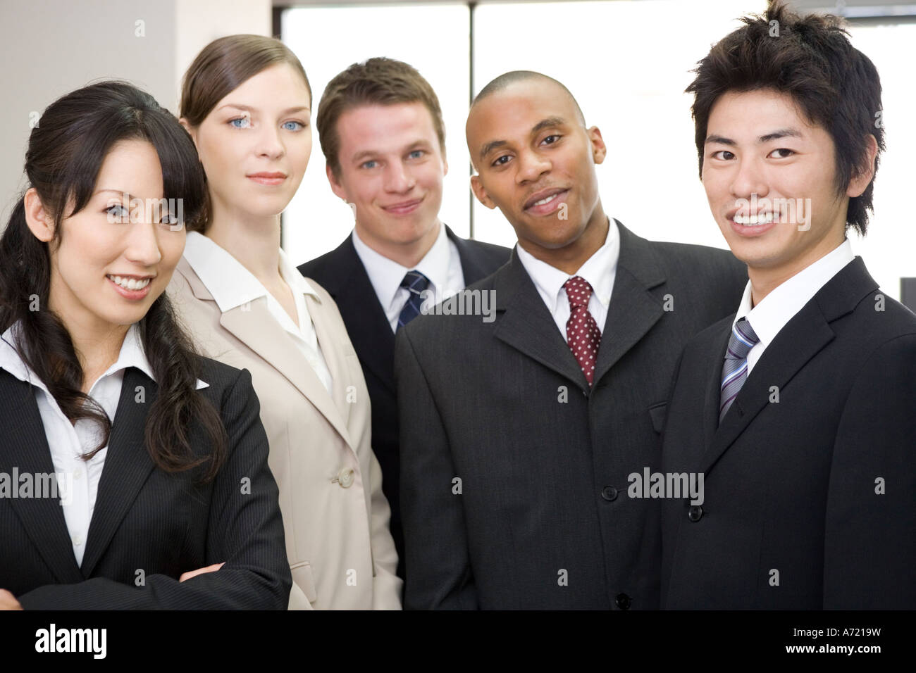 Group of business people looking at camera Stock Photo