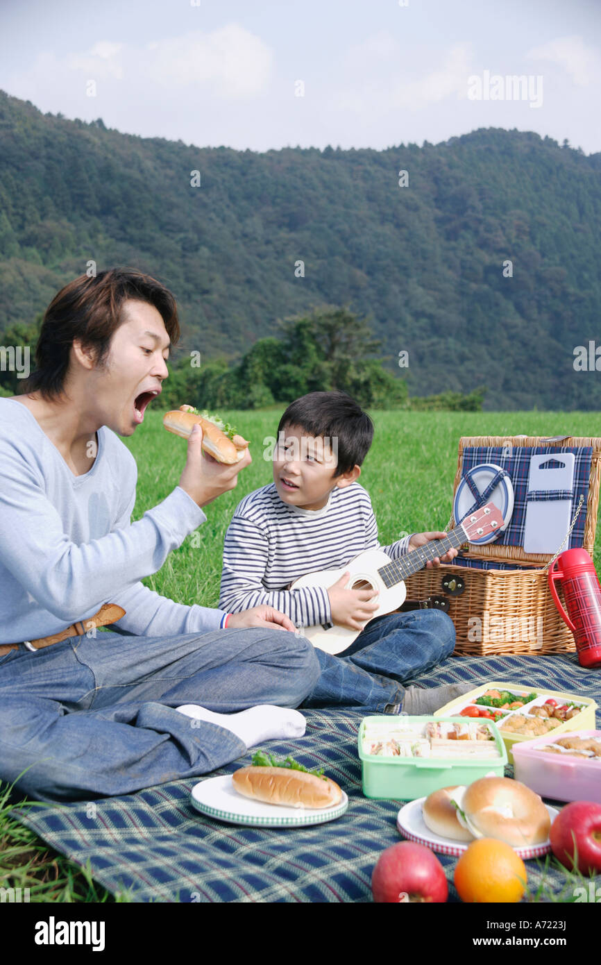 Family boy picnic basket eating hi-res stock photography and images - Alamy
