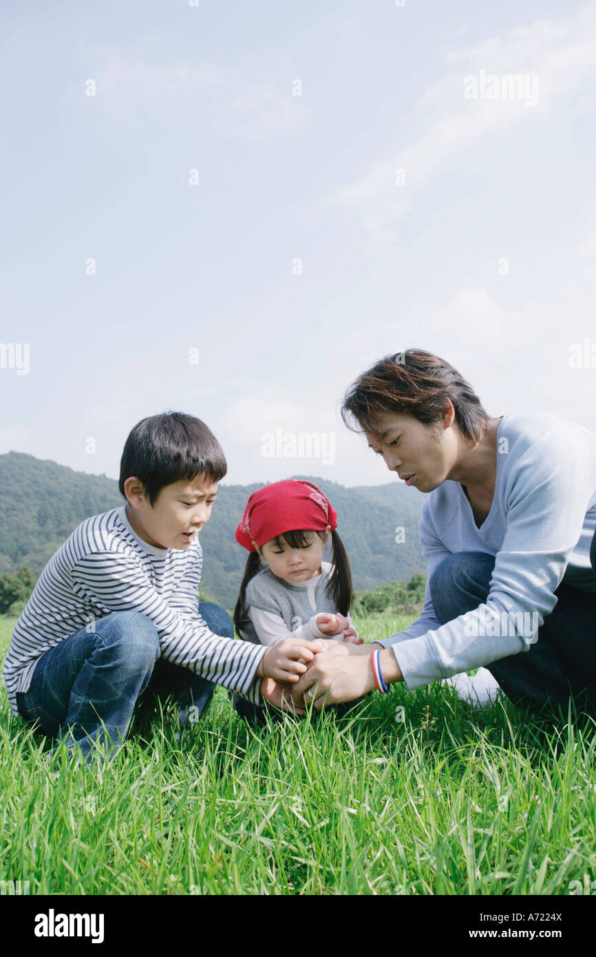 Family catching insects in hi-res stock photography and images - Alamy