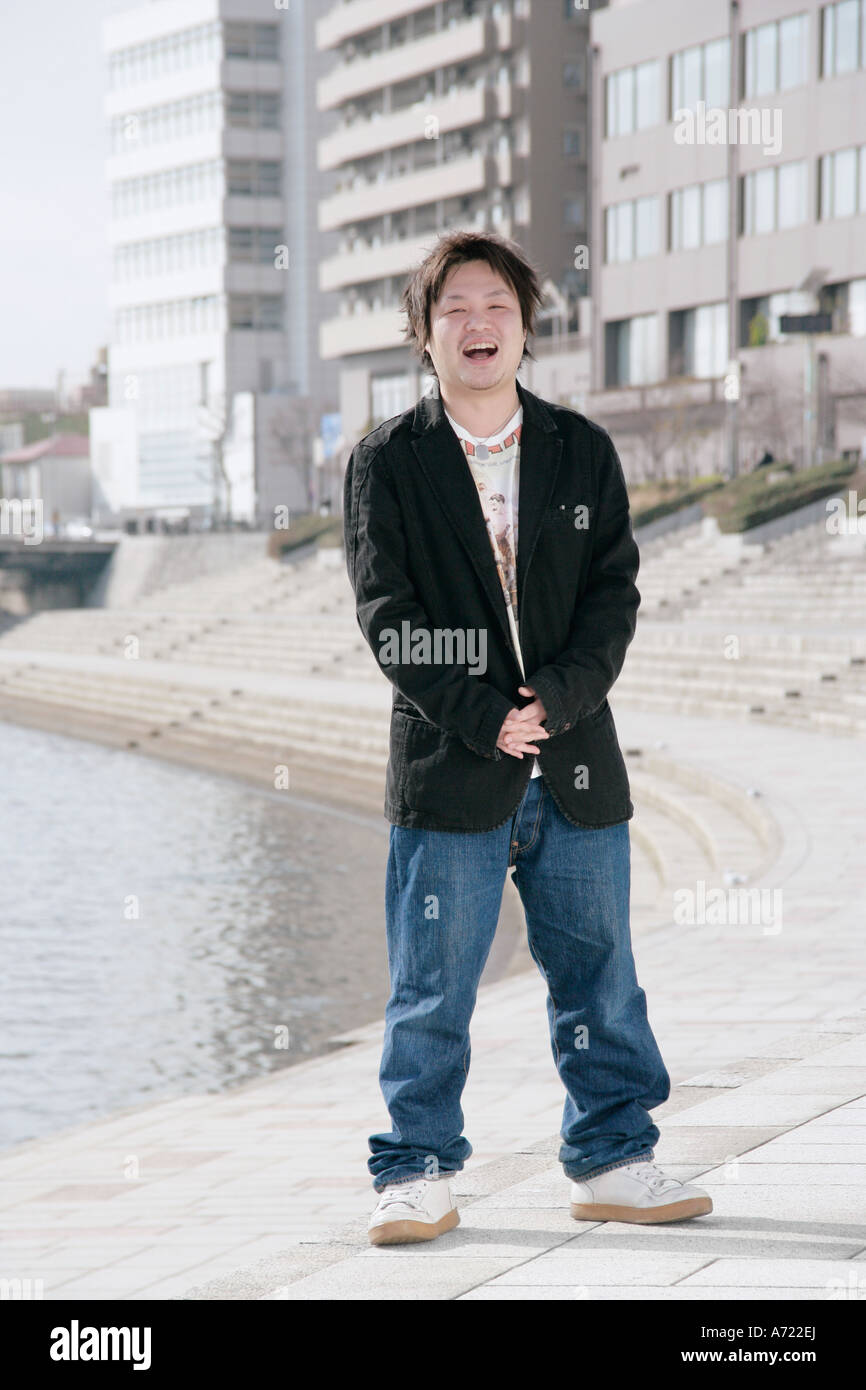 Portrait of a young man smiling Stock Photo - Alamy