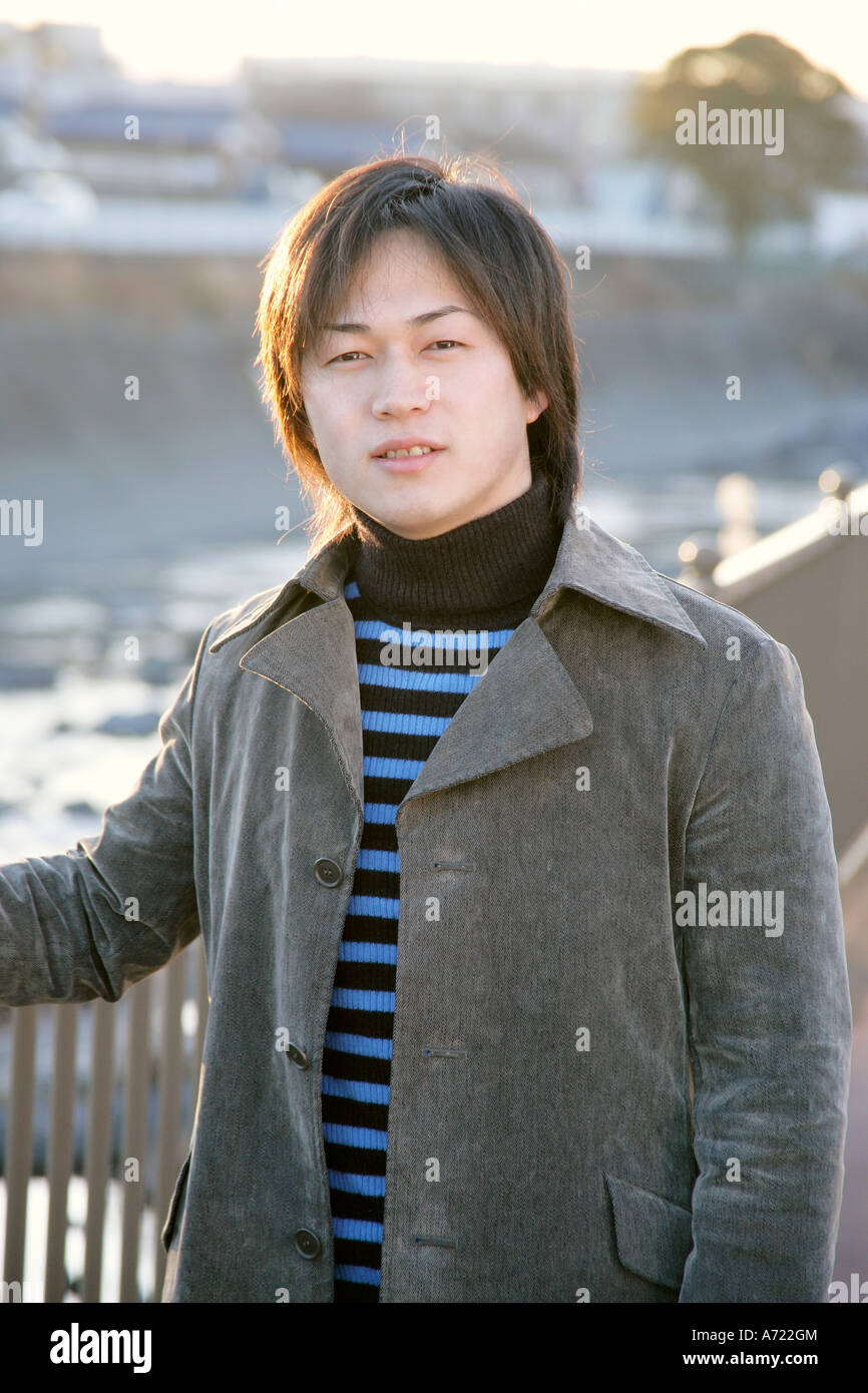 Portrait of a young man smiling Stock Photo - Alamy