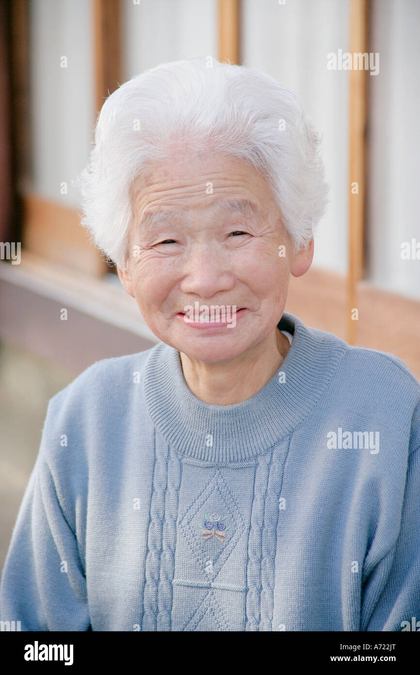 Portrait of a senior woman smiling Stock Photo - Alamy